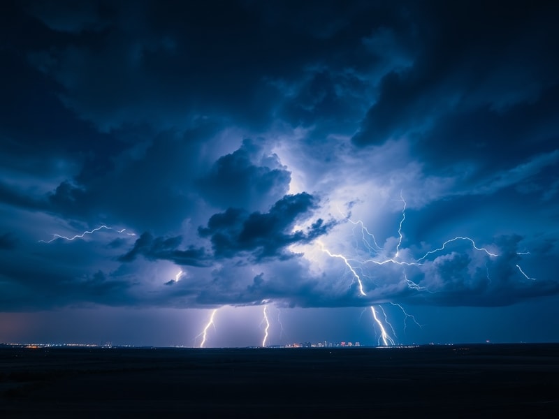 A split-screen image showing a dark stormy sky with lightning strikes over a city skyline on one side, and a close-up of a sm