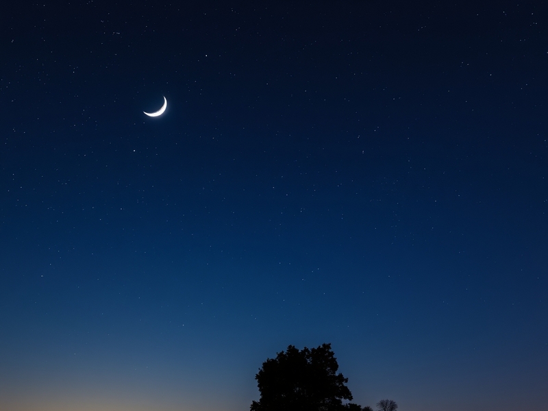 A breathtaking image of the crescent moon and Jupiter in a clear night sky, showcasing their proximity and brilliance against